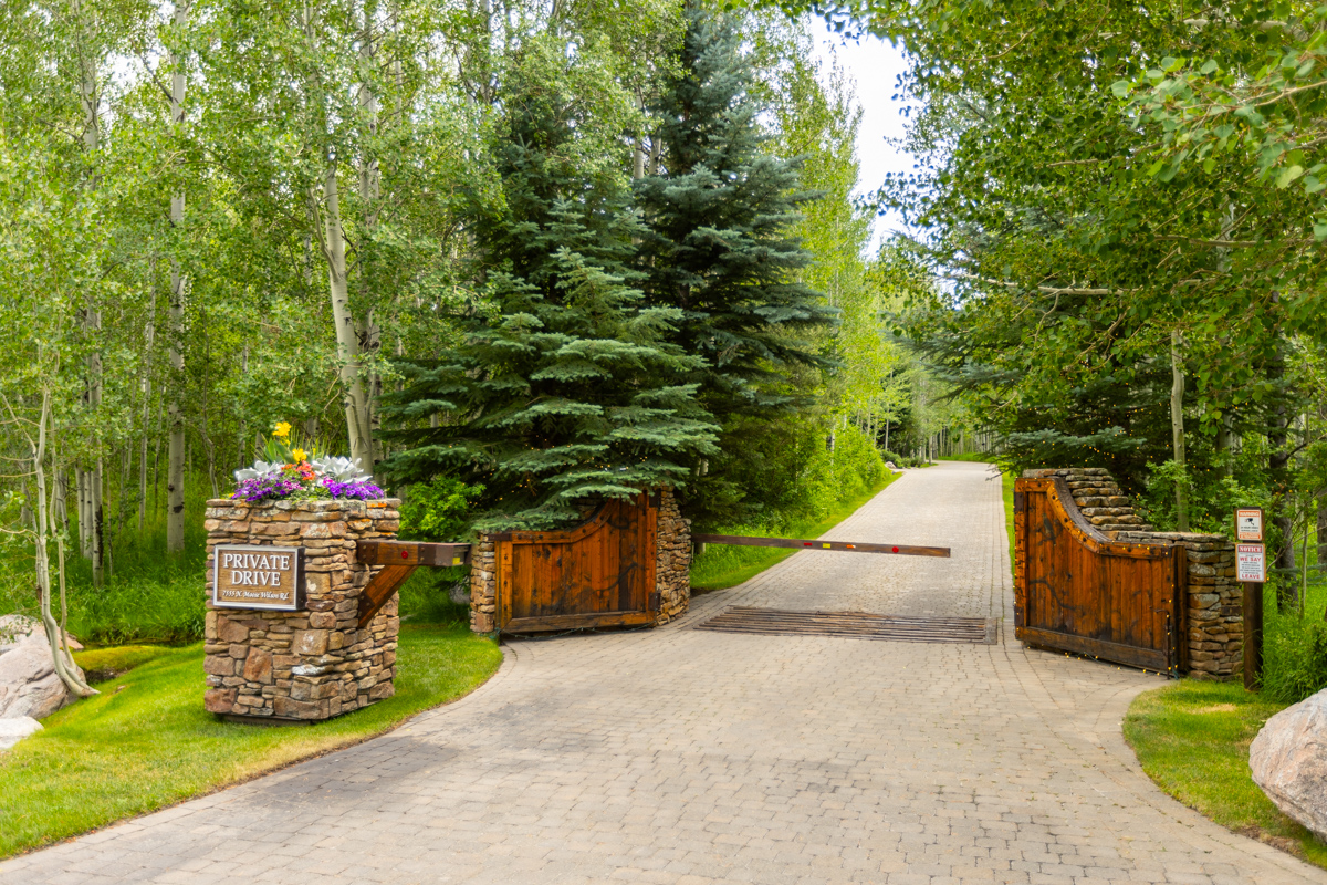 driveway boulders aspen trees planting beds stairs woodland pillar gate