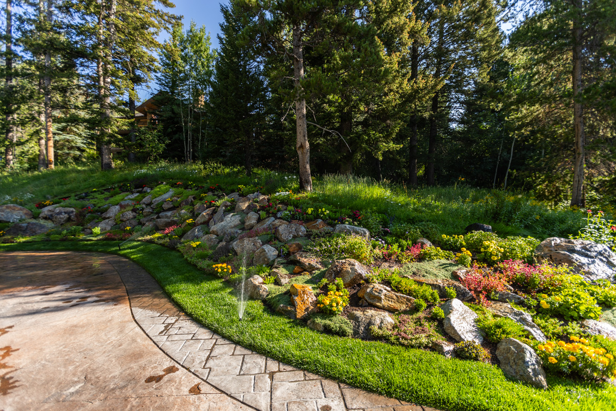 driveway planting bed boulders trees