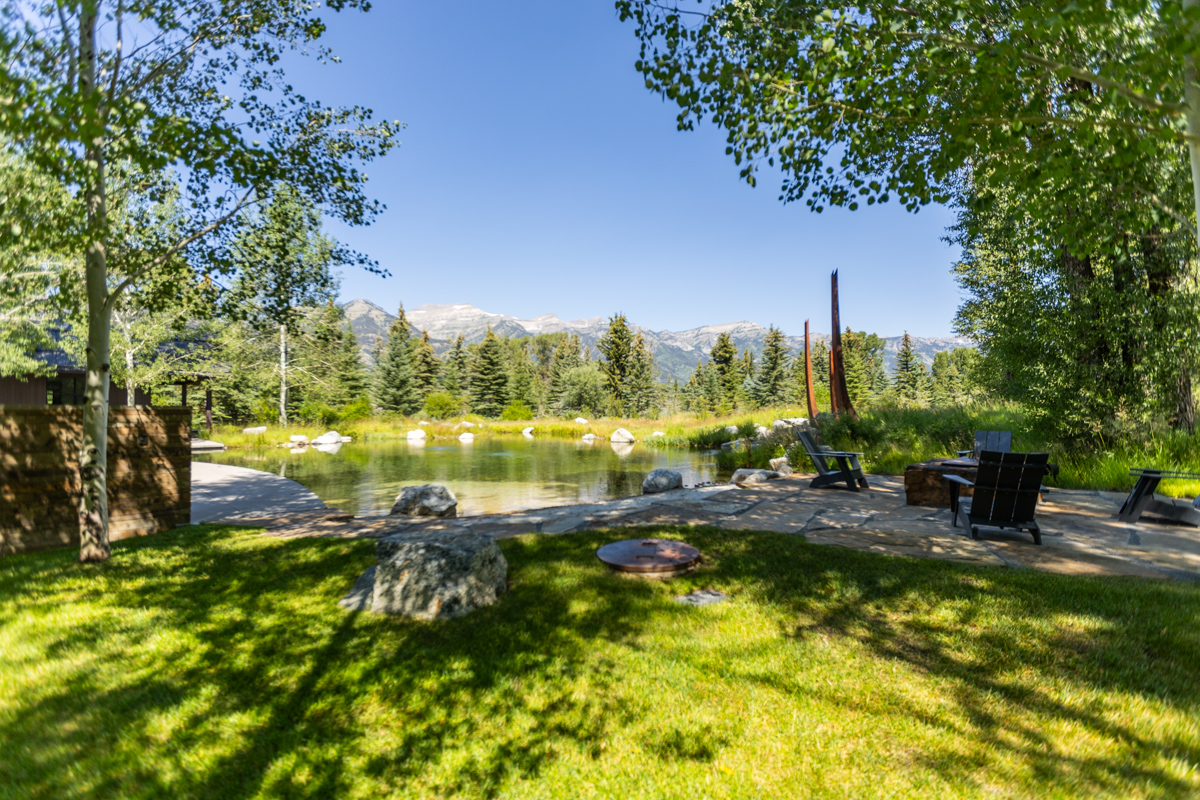 lawn pond trees flagstone patio planting areas