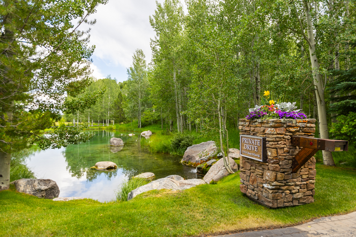 pond lawn woods driveway entrance pillar
