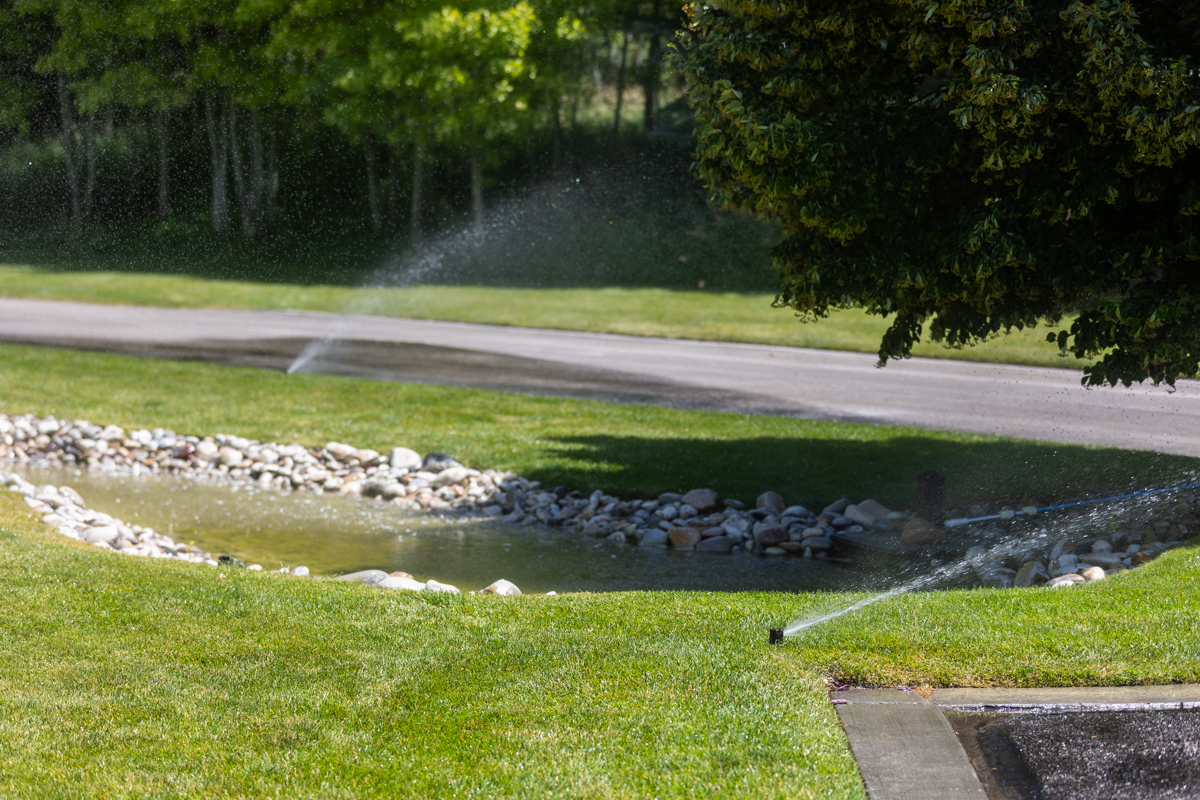 residential maintenance irrigation sprinkler pond lawn