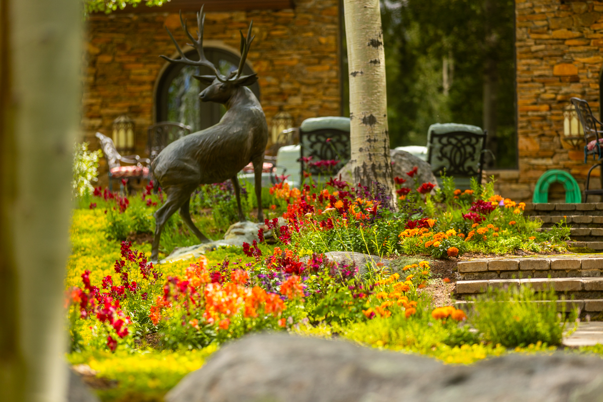 statue planting beds perennials flowers stairs